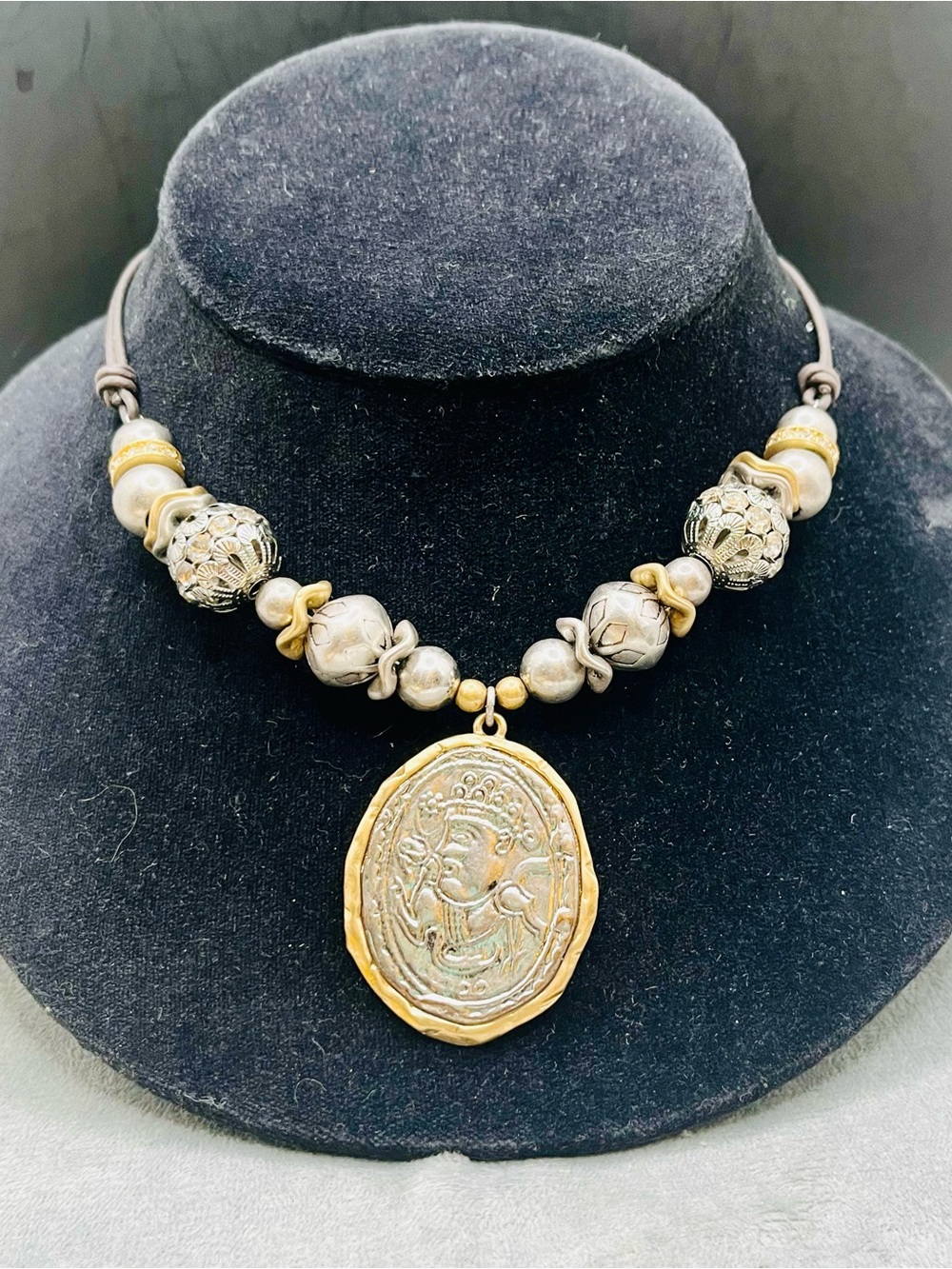 Chico’s faux vintage coin necklace 17”
Adjustable two tone. Corded w/ bead charm